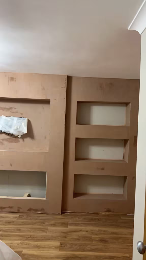 Built-in alcove shelving and a media recess plastered and left to dry